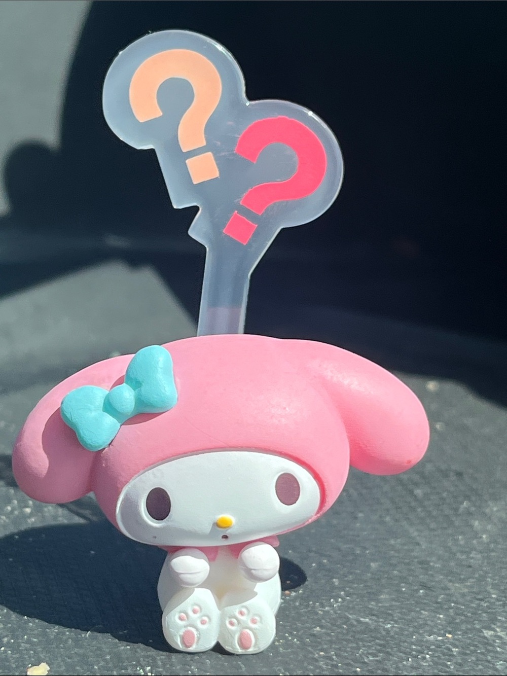 Sanrio My Melody Pink Figure with Turquoise Bow and Question Mark Backdrop